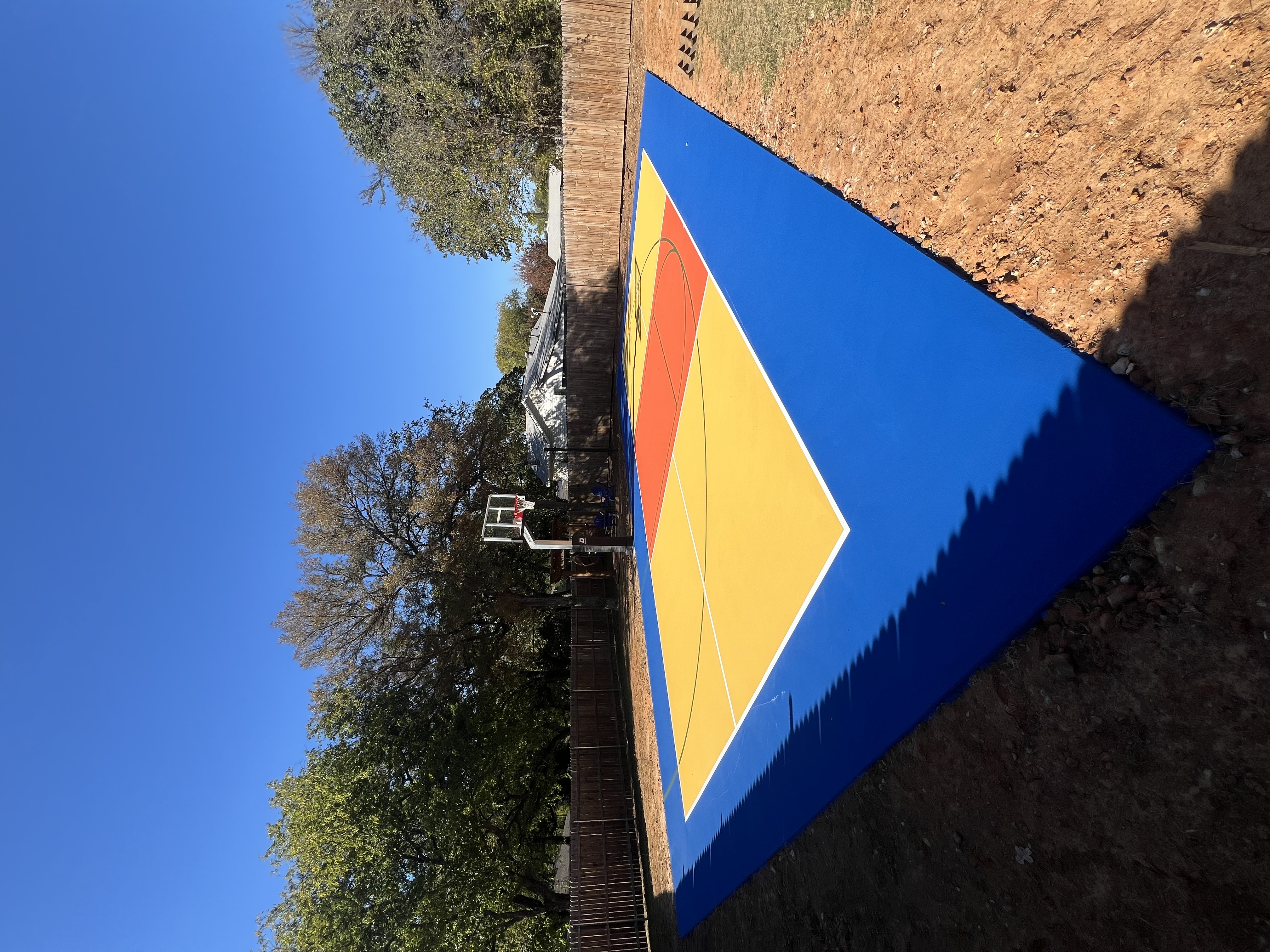 A residential pickleball and basketball court